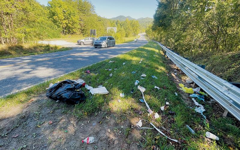 This line of garbage debris was sitting just outside the former entrance to the Sweetwater Road (N.C. Highway 143) Convenience Center on Monday, but has since been cleaned up. Visuals like this are becoming more common in Graham County. Photo by Randy Foster/news@grahamstar.com