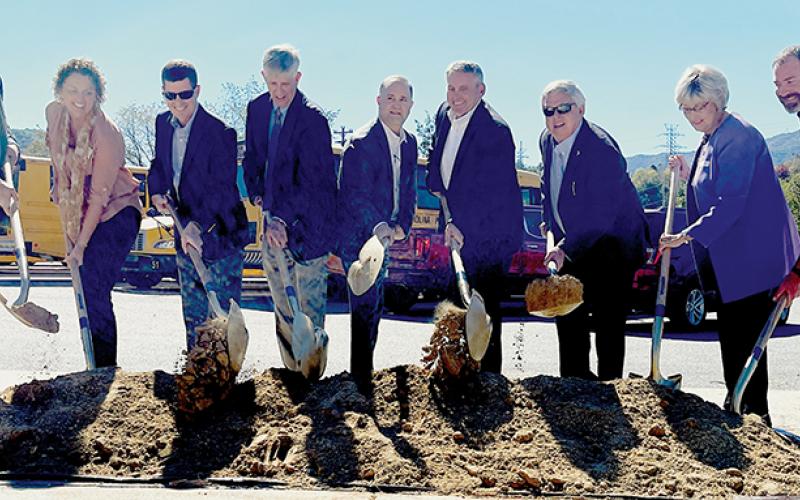 Dignitaries participate in a ceremonial groundbreaking for the Corridor K highway project in Graham County at Robbinsville High School on Monday. From left are Ronnie Keeter, Wanda Austin, Brian Burch, John Sullivan, Eric Boyette, Chris Peoples, Dirk Cody, Connie Orr and Jacob Nelms. Photo by Randy Foster/news@grahamstar.com