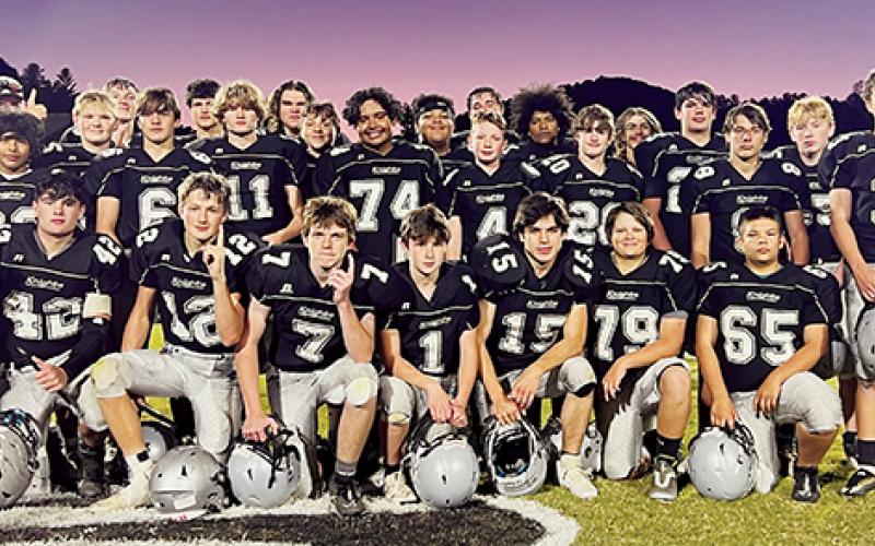 The JV Robbinsville Black Knights gather for one last time at midfield on Sept. 28 following their 26-6 win over Hayesville. The victory clinched a share of the Smoky Mountain Conference title. Photo by Kevin Hensley/sports@grahamstar.com