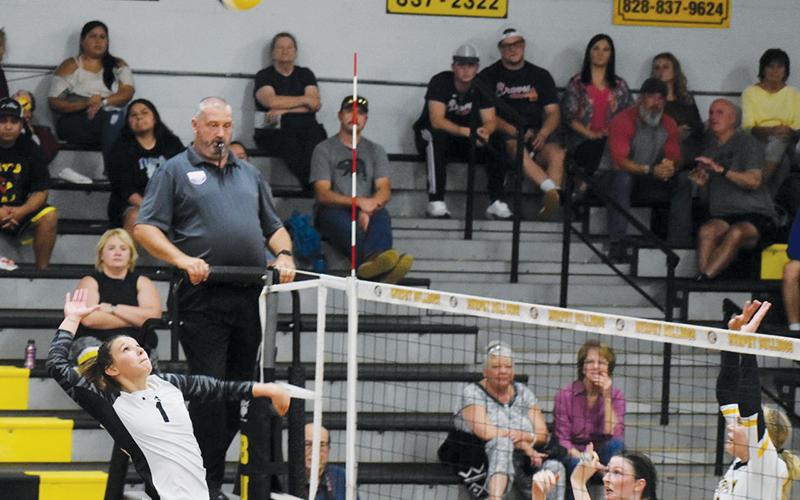 Robbinsville’s Delaney Brooms (1) springs to a kill attempt during Tuesday’s road conference match at Murphy. The Lady Knights dropped the match in four sets and are now tied with the Lady Bulldogs atop the divisional standings. Photo by Justin Fitzgerald/Cherokee Scout
