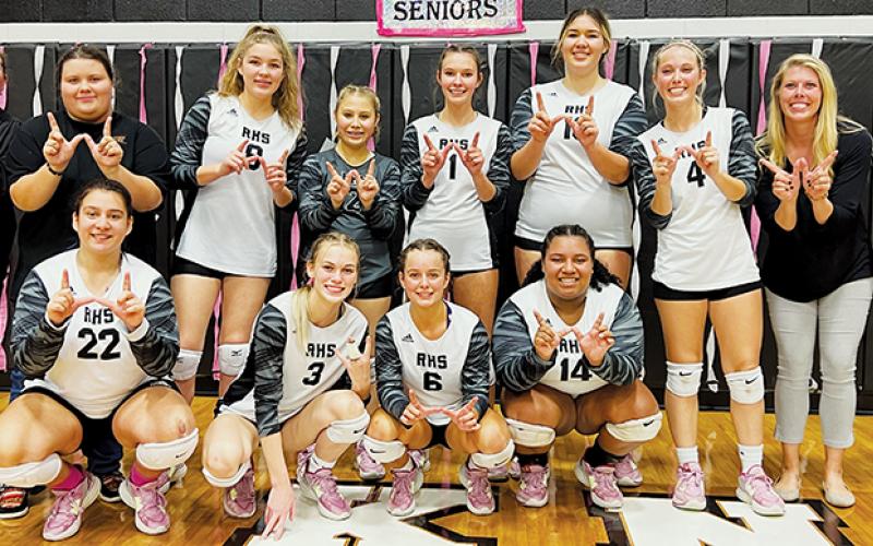 The Robbinsville Lady Knights clinched a share of the Smoky Mountain Conference title for the second time in four seasons Oct. 13, sweeping Swain County on senior night. All names are listed from left. Front row: Fala Welch, Claire Barlow, Desta Trammell and Tai Owle. Back row: Assistant coach Dede Brooms, manager Eden Orr, Liz Carpenter, Suri Watty, Delaney Brooms, Aubrie Wachacha, Kensley Phillips, head coach Kadey Phillips and line judge Jade Teesateskie. Photo by Kevin Hensley/sports@grahamstar.com