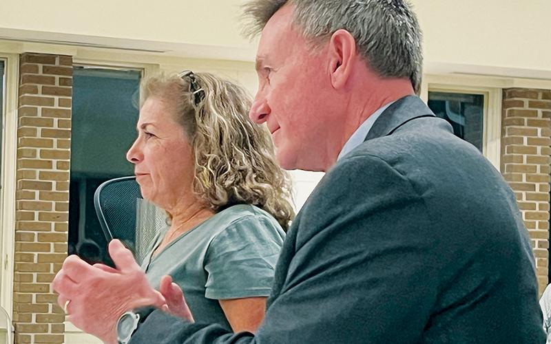 John Emerson briefly applauded after the Graham County Board of Elections dismissed the voter challenge against his wife Tina on Sept. 28. Tina displayed a smile in the moments after the decision. Photos by Kevin Hensley/editor@grahamstar.com