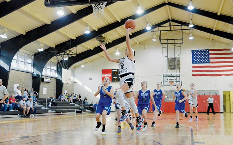 Zayleigh Chekeleelee outpaces the pursuit of Hiwassee Dam/Ranger defenders for a lay-up during the Nov. 3 season opener. Chekeleelee led the Lady Knights with a 10-point afternoon. Photos by Kevin Hensley/sports@grahamstar.com