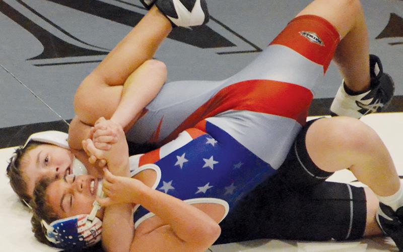 Robbinsville Middle School’s Aiden Conley has his Madison opponent all knotted up during Tuesday’s dual with the Patriots.
