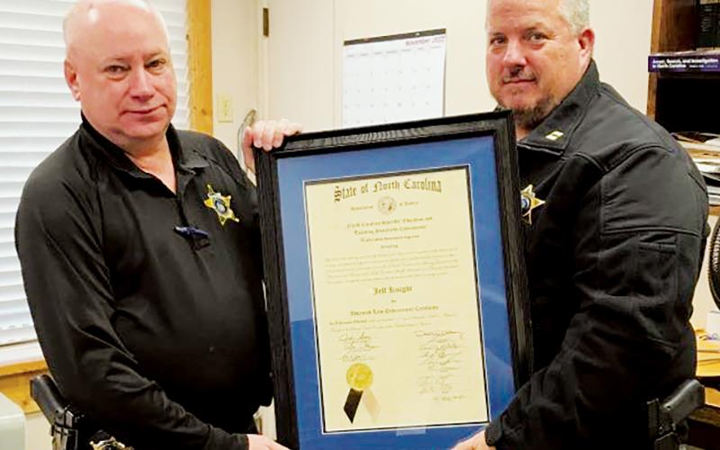 Graham County Sheriff’s Office Detective Jeff Knight (right) received the Advanced Service Award from the N.C. Sheriffs’ Education and Training Standards Commission. With Knight is Graham County Sheriff Jerry Crisp.