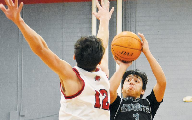 Xander Wachacha – shown unloading a second-half 3 on Dec. 20 at Andrews – had a team-high 21 points in Robbinsville’s loss to Smoky Mountain on Tuesday. Photo by Kevin Hensley/sports@grahamstar.com