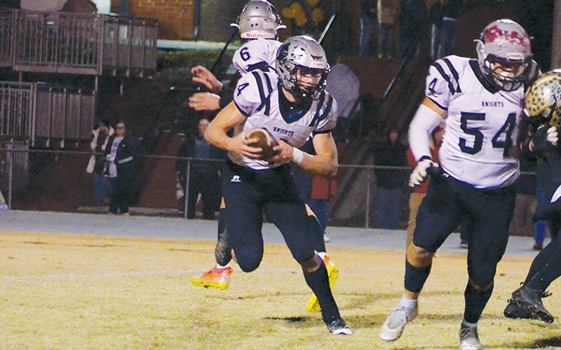 Cuttler Adams examines the Eastern Randolph defense in the third round of the 1A playoffs on Nov. 18. Adams was recently afforded the distinction of Co-Smoky Mountain Conference Back of the Year. Photo by Kevin Hensley/sports@grahamstar.com
