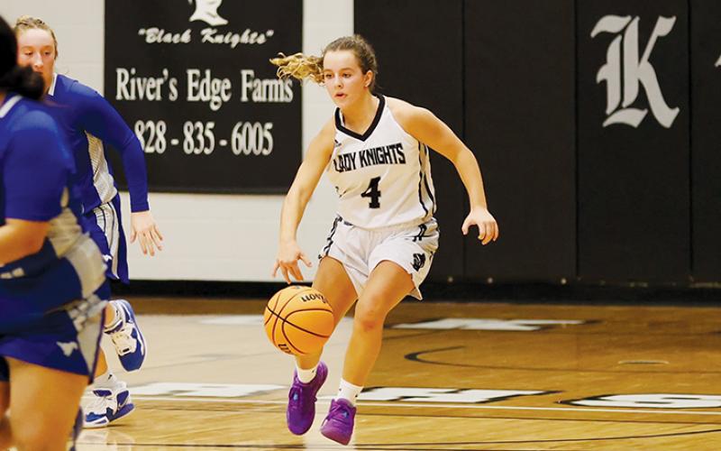 Desta Trammell speeds up the floor during Nov. 30’s season opener against Smoky Mountain.  Trammell’s historic, consecutive free-throw streak ended in the Lady Knights’ campaign debut, but she still lead the team in three different categories – including a 26-point evening. Photo courtesy of Miranda Buchanan/Robbinsville High School Yearbook