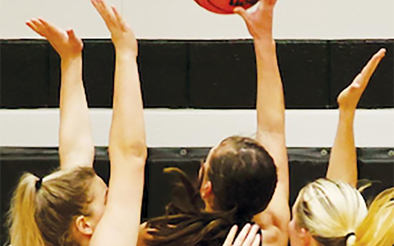 Robbinsville’s Liz Carpenter (23) and Kensley Phillips slow down the drive of North Buncombe’s Peyton Whitson on Friday. Photo by Miranda Buchanan/Robbinsville High School Yearbook
