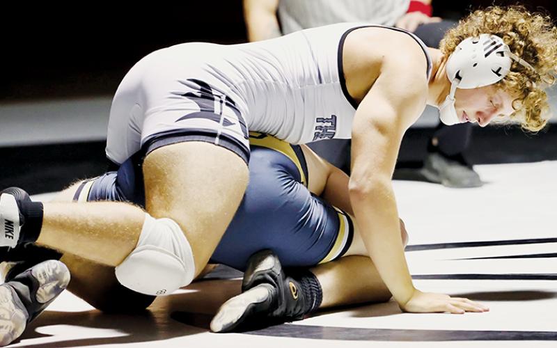 Robbinsville senior Turner Jackson dictates his Dec. 20 home bout against Hayesville’s Seth McCaslin. Jackson went on to best McCaslin in a 15-2 majority decision. Photo courtesy of Miranda Buchanan/Robbinsville High School Yearbook
