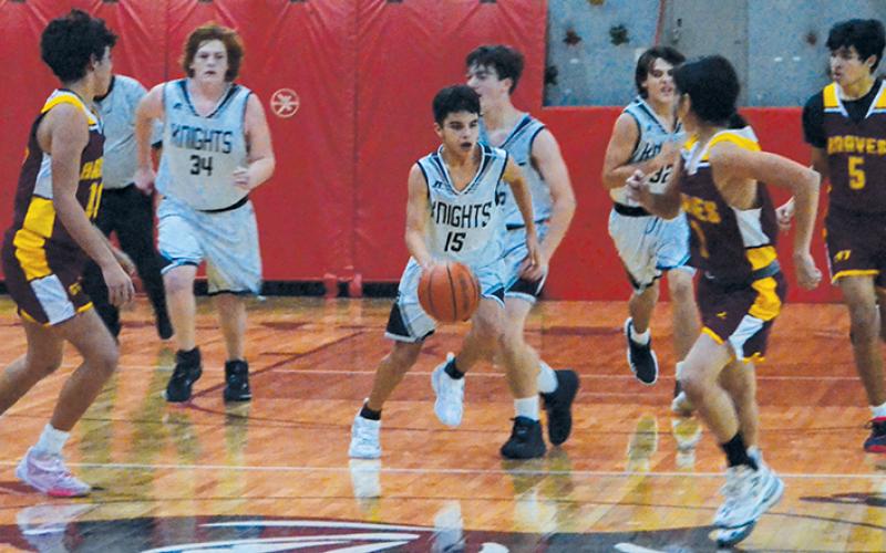 Robbinsville Middle School’s Xamuel Wachacha weaves through heavy transition traffic Dec. 5 against Cherokee. Photo by Kevin Hensley/sports@grahamstar.com