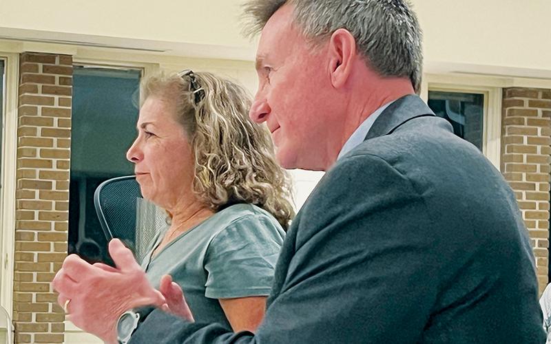John Emerson briefly applauded after the Graham County Board of Elections dismissed the voter  challenge against his wife Tina on Sept. 28. Tina displayed a smile in the moments that immediately followed the decision. Photo by Kevin Hensley/editor@grahamstar.com