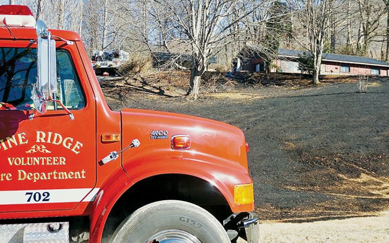 Fire engines from around the county were dispatched to a home fire in the Santeetlah area Dec. 29. Photo by Randy Foster/news@grahamstar.com
