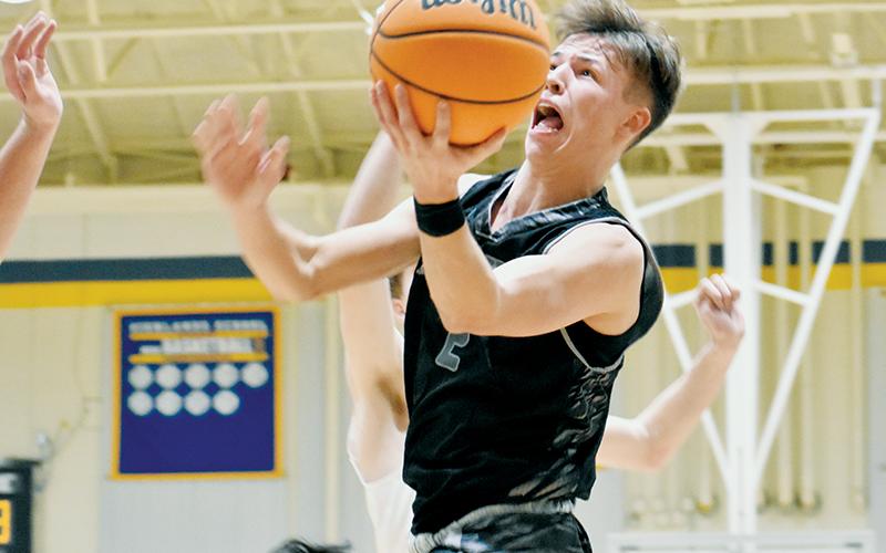 Brock Adams takes flight Monday at Highlands. Robbinsville’s senior point guard was one of three Black Knights to reach double digits in the victory. Photo by Kevin Hensley/sports@grahamstar.com