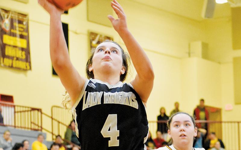 All Cherokee’s Alexis Smith could do was look on as Desta Trammell took flight for a second-half bucket Tuesday at Cherokee. Trammell had 42 points at Swain County on Jan. 19 and her 23-point evening at Cherokee pushed her to 1,603 career points. Photo by Kevin Hensley/sports@grahamstar.com