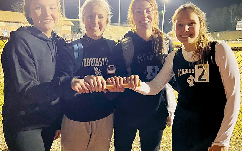 The Lady Knights’ collaboration of Katie-Lyn Gross, Kensley Phillips, Zoie Shuler and Delaney Brooms (from left) broke the 4x400, indoor-track school record Jan. 11 at Swain County, clocking in with a time of 4:34.98. The previous mark was 4:45.20, set by Ashlyn Waldroup, current coach Kaitlyn Carringer, Meghan Myler and Shawnda Martin during the 2015-16 season. Photo by Kevin Hensley/sports@grahamstar.com