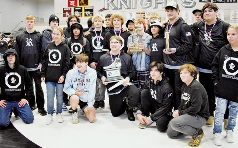 Members of the Robbinsville wrestling program gather with the 2023 James Orr Memorial  Invitational runner-up trophy, clinched after hosting their signature tournament Saturday. Photo by Kevin Hensley/sports@grahamstar.com