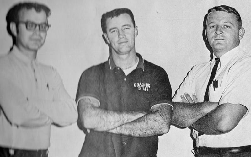 Flanked by assistants Bergin Edwards (left) and John Bandy (right) before the 1969 season, Bob Colvin became the architect for success within the annals of  Robbinsville High School football. Under his leadership, the Black Knights won 11 of the program’s 14 state championships.