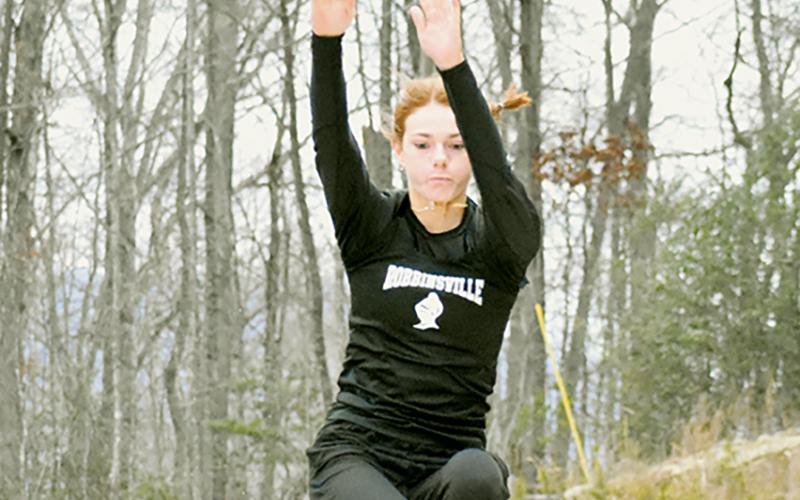 Lady Knights junior Zoie Shuler takes flight during an indoor track meet at Swain County on Jan. 11. Shuler is the favorite to win at least two state championships for Robbinsville this weekend. Photo by Kevin Hensley/sports@grahamstar.com