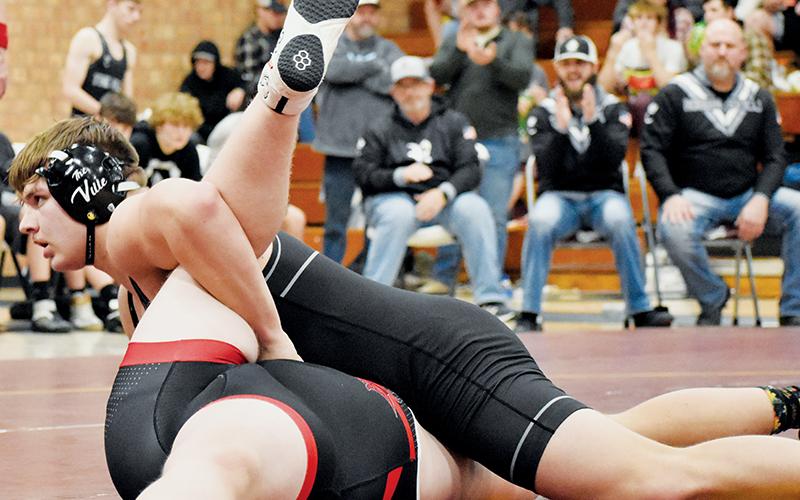 Koleson Dooley defiantly pins Avery County’s Connor Brewer in the heavyweight bout of Feb. 1’s Western Regional Finals match at Swain. Dooley’s pin gave Robbinsville an 18-6 lead, but the Vikings would rally and advance to the state-dual championship. Photo by Kevin Hensley/sports@grahamstar.com