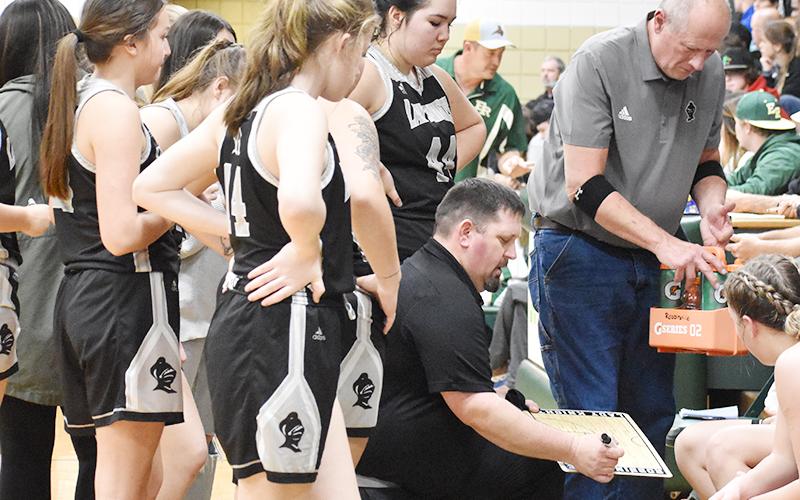 Lady Knights head coach Lucas Ford draws up a play during a timeout at Feb. 25's, third-round postseason game against Eastern Randolph. Photo by Montana Buchanan/The Graham Star
