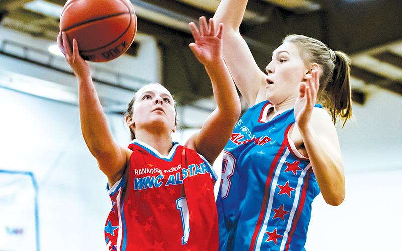 Robbinsville's Desta Trammell (left) drives to the net Saturday in the WNC Girls All-Star Game at Warren Wilson College in Swannanoa. Photo courtesy of Josh Bell Photography