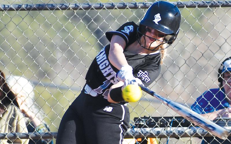 Junior Taelyr Jackson swings for an eventual double Tuesday, which was mixed into a 9-run third for Robbinsville in the Lady Knights’ 14-1 rout of Smoky Mountain. Photos by Montana Buchanan/The Graham Star
