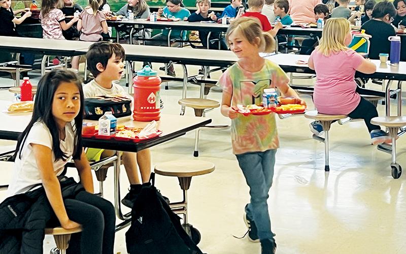 Students at Robbinsville Elementary School enjoy lunch inside the cafeteria Tuesday. It was announced Monday that pupils across the district will enjoy free breakfast and lunch for the next four years. Photo by Kevin Hensley/editor@grahamstar.com