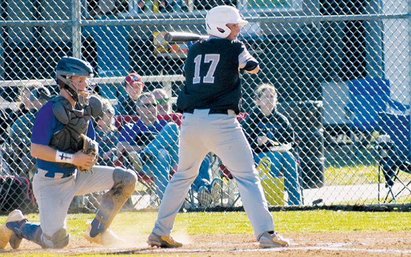 Ethan Orr patiently awaits his chance to swing Monday against Towns County, Ga. The next day, Orr homered and pitched a complete game for Robbinsville, helping lift the Black Knights to a 5-3 home win over Rosman. Photo courtesy of Fala Welch/Contributing Photographer