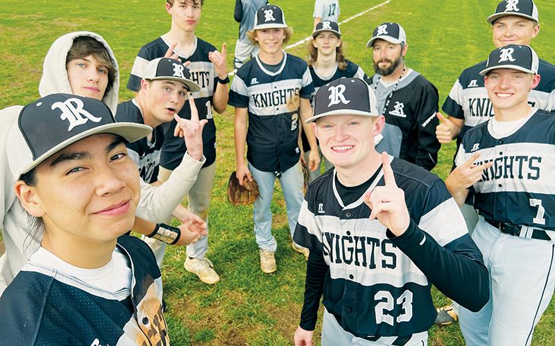 The Robbinsville Black Knights have good reason to smile: the team has recently put together its first winning streak of the season. Graylen Orr (2) struck out 10 Copper Basin batters in just four innings of work Monday, as Robbinsville made the streak official with an 8-7 win over the Cougars. Clockwise from Orr are Bryc  Garrison, head coach Brent Icenhower, Lathan Buchanan, Alex Knight, Caleb Turpin, Quinn Jumper, Preston Phillips, Ethan Orr and Bryce Adams. Photo by Kevin Hensley/sports@grahamstar.com