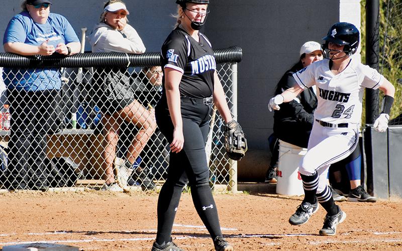 All Smoky Mountain senior Bailey Cloer (8) could do was watch as outfielders madly attempted to field a ball driven to the outer reaches by Lady Knights senior Kensley Phillips. Phillips doubled on the second-inning drive and recorded her Knights-leading fifth triple at Andrews on Tuesday. Photo courtesy of Bentley Riggs/Contributing Photographer