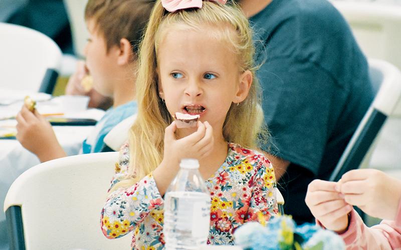 Dixie Leonard bites into the deliciousness of a sample provided to those who attended the Bunny Hop Tasting Event that was held as part of Robbinsville High School’s SpringFest on Saturday. Photos by Kevin Hensley/editor@grahamstar.com