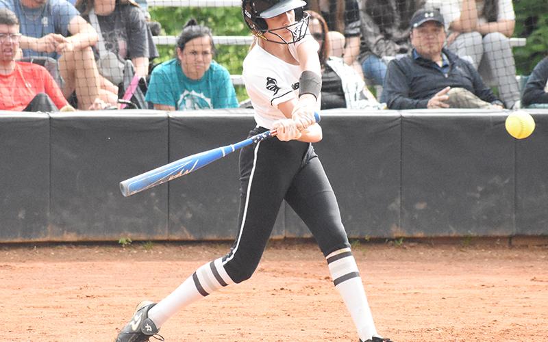 Freshman Lady Knight Anna Williams turns on a pitch during May 11's home playoff game against Elkin. Photo by Montana Buchanan/The Graham Star