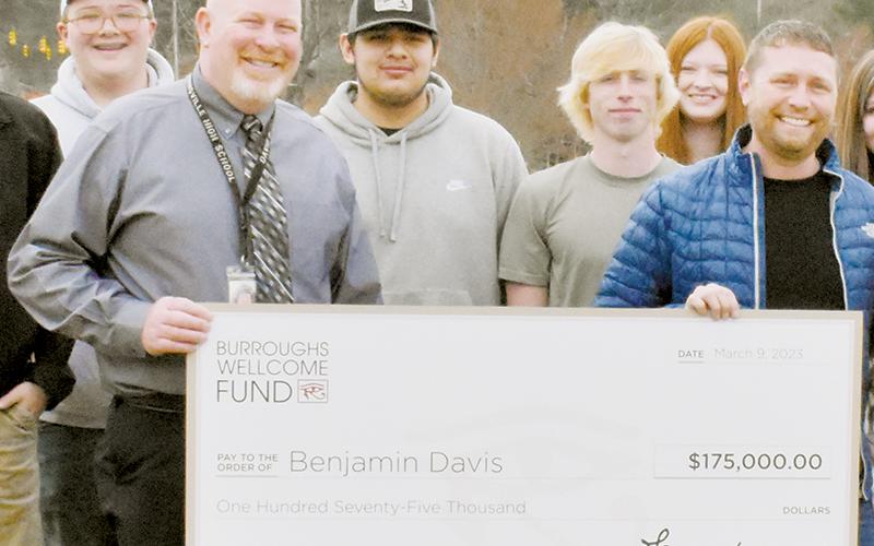 Robbinsville High School Principal David Matheson (left) stands with science instructor Ben Davis on March 9, during a presentation of $175,000 to Davis from the Burroughs Wellcome Fund Grant program. Davis has been announced as the school's 2022-23 Teacher of the Year. Photo by Kevin Hensley/editor@grahamstar.com