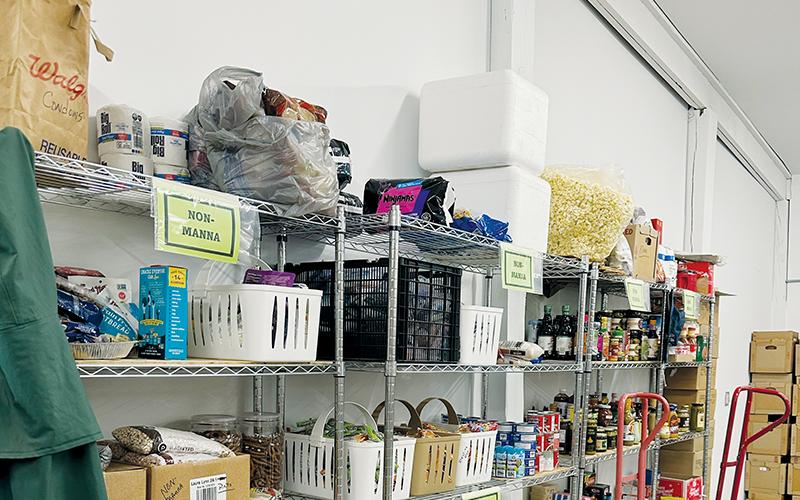 Though it may appear from this photo that plenty of food is in stock for free distribution at the Five Points Center, there can never be enough for those in need. Photo by Latresa Phillips/The Graham Star