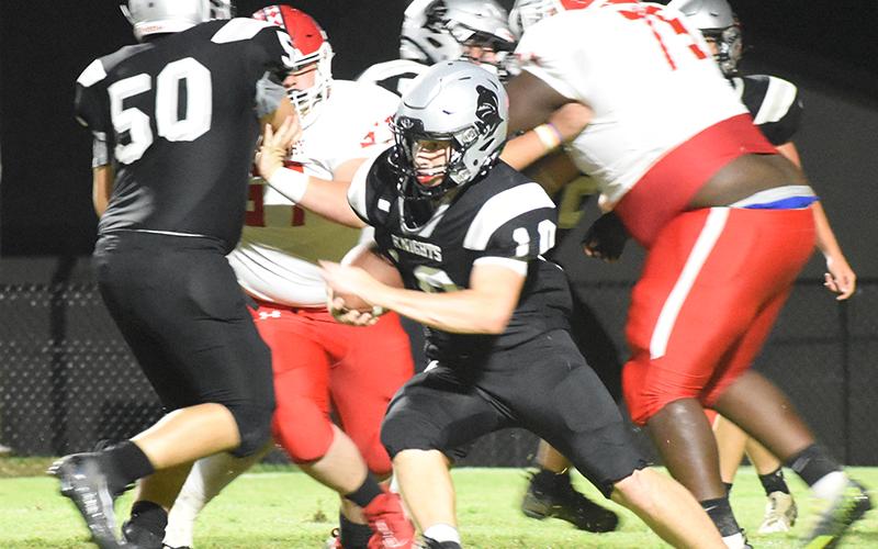 Tanner Hedden (10) weaves through traffic during Friday’s season opener against East Surry. Photo courtesy of Danielle Crabtree