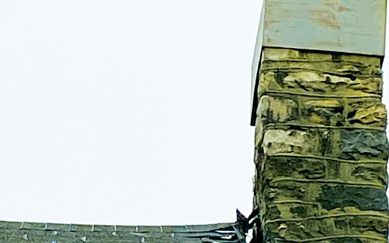 As seen in this photo, the chimney atop “The Hut” is separating from the cabin resting below..