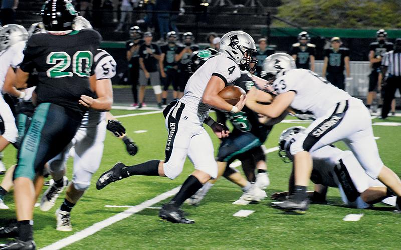 Robbinsville’s Cuttler Adams emerges for an eventual 29-yard touchdown run that would cement the Knights’ 28-17 win at Mountain Heritage on Friday. Adams now has 5,075 rushing yards in his career. Photos by Kevin Hensley/sports@grahamstar.com