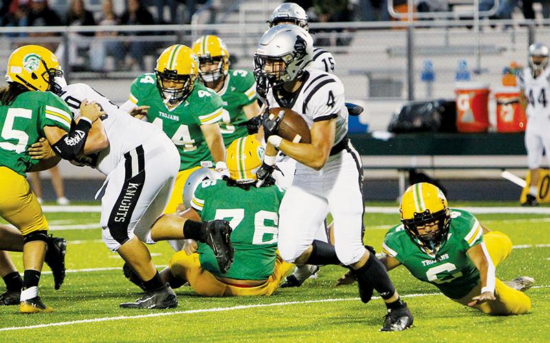 Cuttler Adams evades the capture of Alleghany’s Alexis Nuevo on Friday.