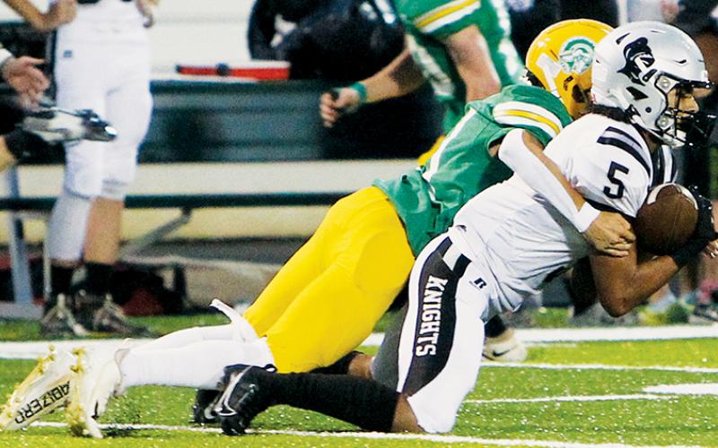 Darion Ledbetter clutches one of his two interceptions Friday at Alleghany – both of which led to touchdowns in Robbinsville’s 35-7 win over the Trojans. Photos courtesy of Stewart Royall/Studio Roxie