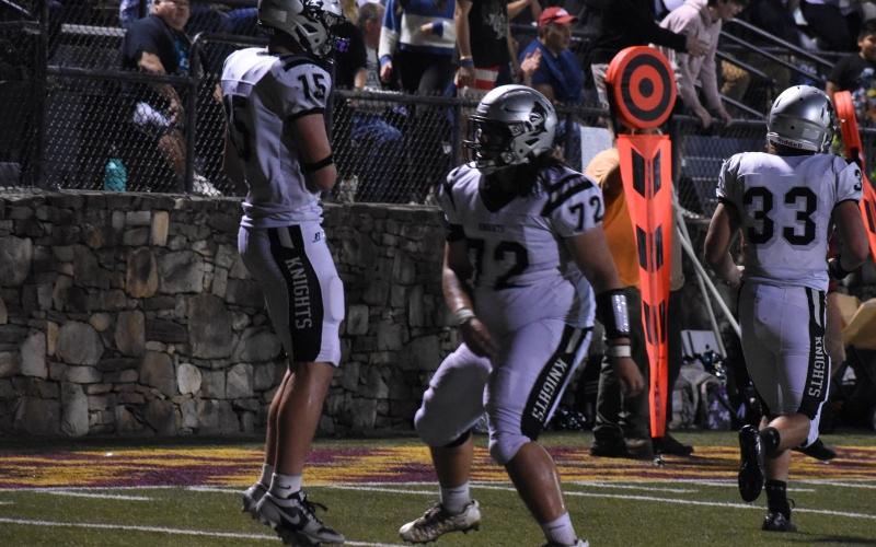 Roman Jones (15) and Tytan Teesateskie (72) celebrate Jones’ two-point conversion pass reception Friday at Cherokee. The snag capped the first scoring drive of the game for either team, with Robbinsville pouring it on from that point forward in a 46-6 rout of the Braves. Photo by Kevin Hensley/sports@grahamstar.com