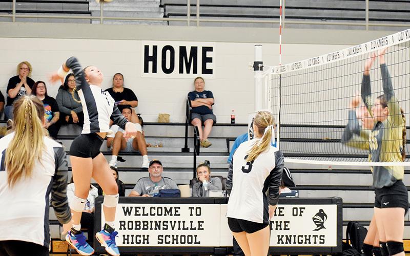 Delaney Brooms rises toward a definitive kill Tuesday against Hayesville. The senior outside hitter was a thorn in the Jackets’ side throughout Robbinsville’s win. Photo by Danielle Crabtree/The Graham Star