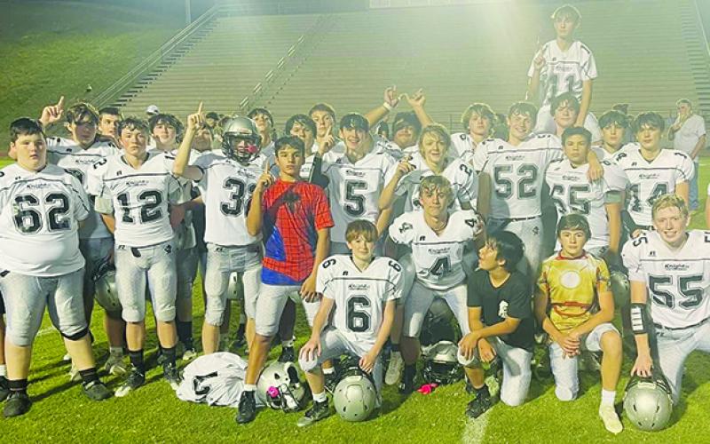Moments after securing the program’s first outright JV conference title in over a decade, the Robbinsville Black Knights gather to  commemorate the victory at Swain County High School. Photo courtesy of Tonia Walsh/Robbinsville Middle School