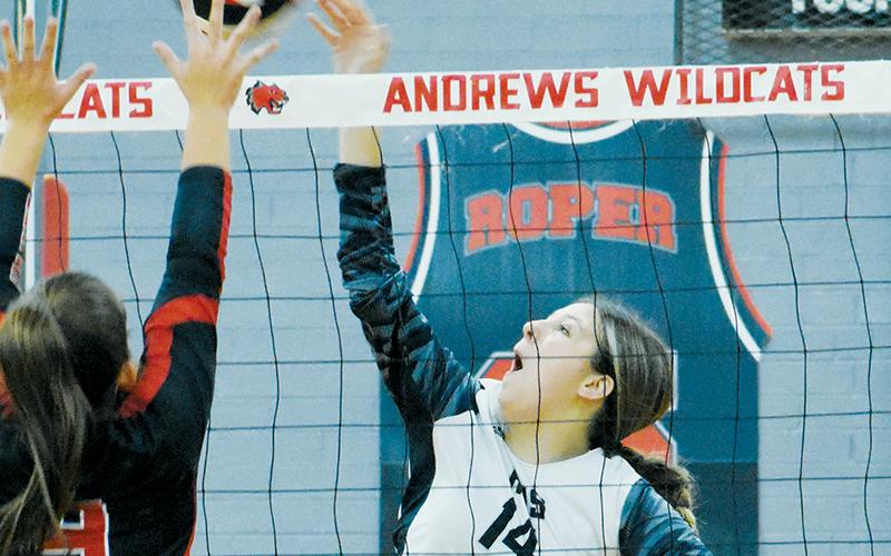 Senior Tia Hall contends the defense of Andrews’  Kinleigh Queen in Robbinsville’s 4-set road victory over the Lady Wildcats. Photo by Kevin Hensley/sports@grahamstar.com