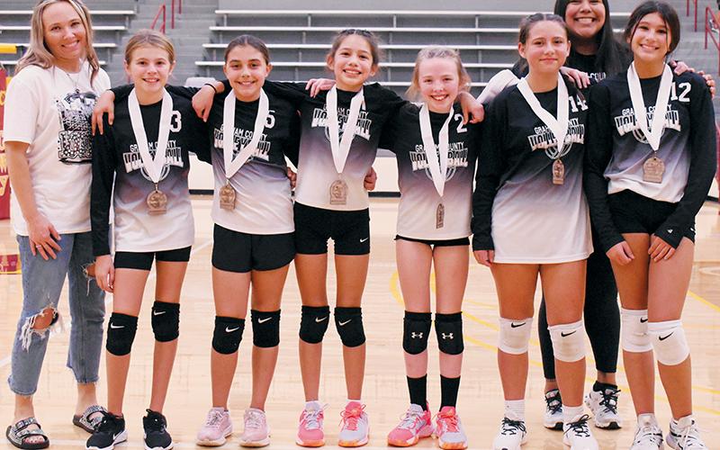 Robbinsville Black emerged as champions of the 2023 Smokey Mountain Youth Conference Volleyball Tournament, which was held Saturday at Cherokee. Robbinsville Black swept another Graham County program – Snowbird – to capture the gold. From left are assistant coach Allison Rogers, Mercy Nelms, McKynlee Adams, Natalie Swimmer, Kamry Rogers, Amiyah Collins, head coach Holly Jackson and Lexi Crisp. Photos by Kevin Hensley/sports@grahamstar.com