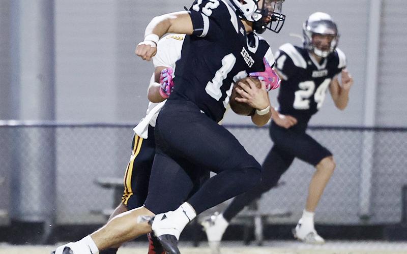 Quinn Jumper is shown rushing for one of his two touchdowns last week against Thomas Jefferson Classical Academy. Jumper did not find the end zone Thursday against Mountain Island Charter – but his defense kept the Raptors rocked throughout Robbinsville's 40-7 triumph in the second round of the state playoffs. Photo courtesy of Miranda Buchanan/Robbinsville High School