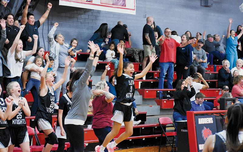The reaction milliseconds after Daphne Barlow roped a long-range prayer through the net to lift Robbinsville past Andrews on Nov. 16 varied, depending on which side of the scorer’s table fans were seated on. Photo by Kevin Hensley/sports@grahamstar.com