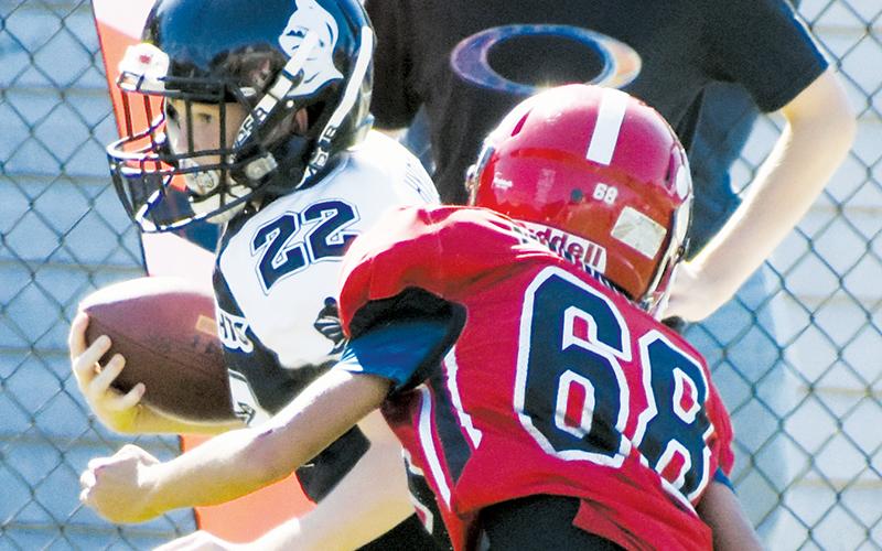 Conner Hyde (22) scored the lone Robbinsville Mites touchdown in Saturday’s semifinal game against Franklin. Though all four Black Knights teams qualified for the postseason, the Mites are the only Robbinsville team advancing to the Cracker Bowl. Photo by Kevin Hensley/sports@grahamstar.com