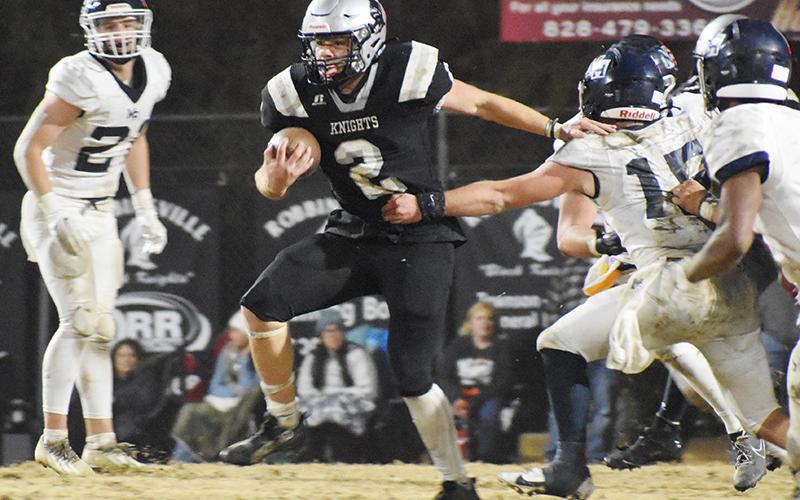 Senior Chase Calhoun (2) shoves away the attempt of Mount Airy’s Ian Gallimore during Friday’s 1A Western Regional Final in Robbinsville. Photo by Fala Welch/The Graham Star