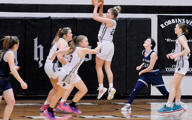 Liz Carpenter pulls down a rebound during Tuesday’s season opener against Nantahala. The junior small forward finished the game with a team-best 19 points. Photos by Fala Welch/The Graham Star
